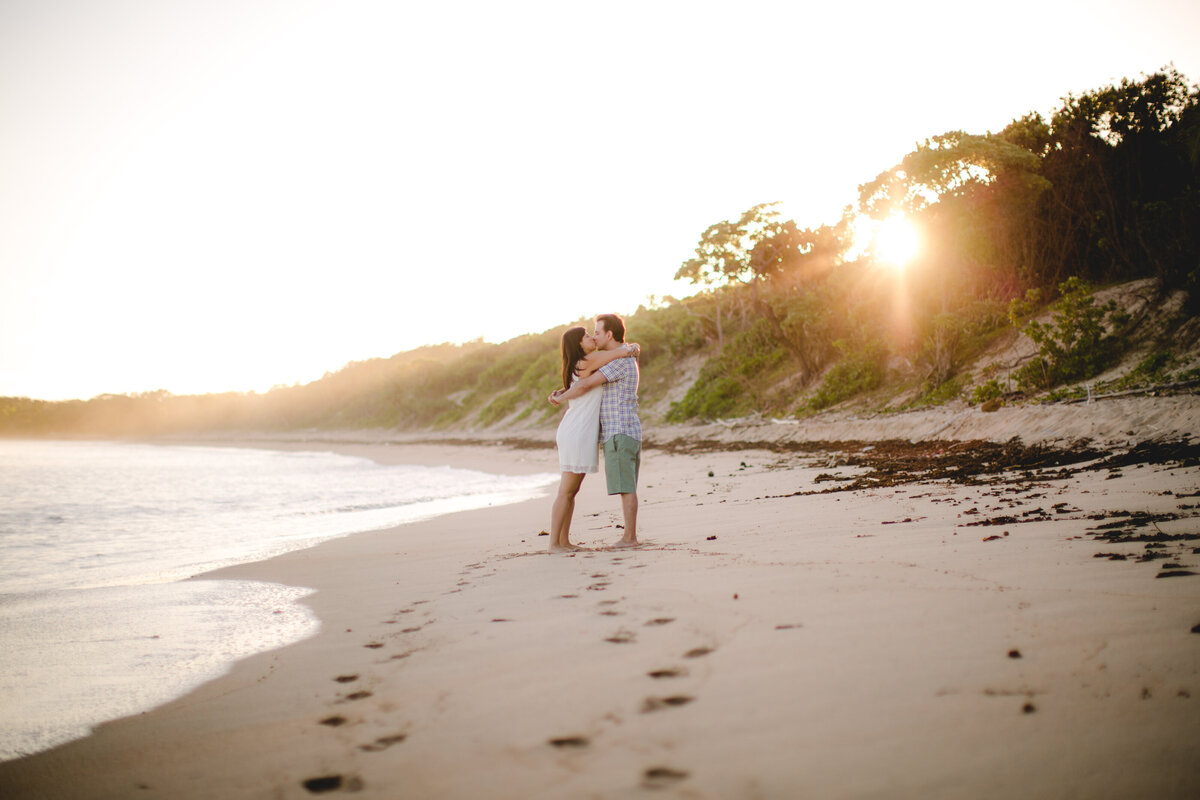 couple on beach at golden hour