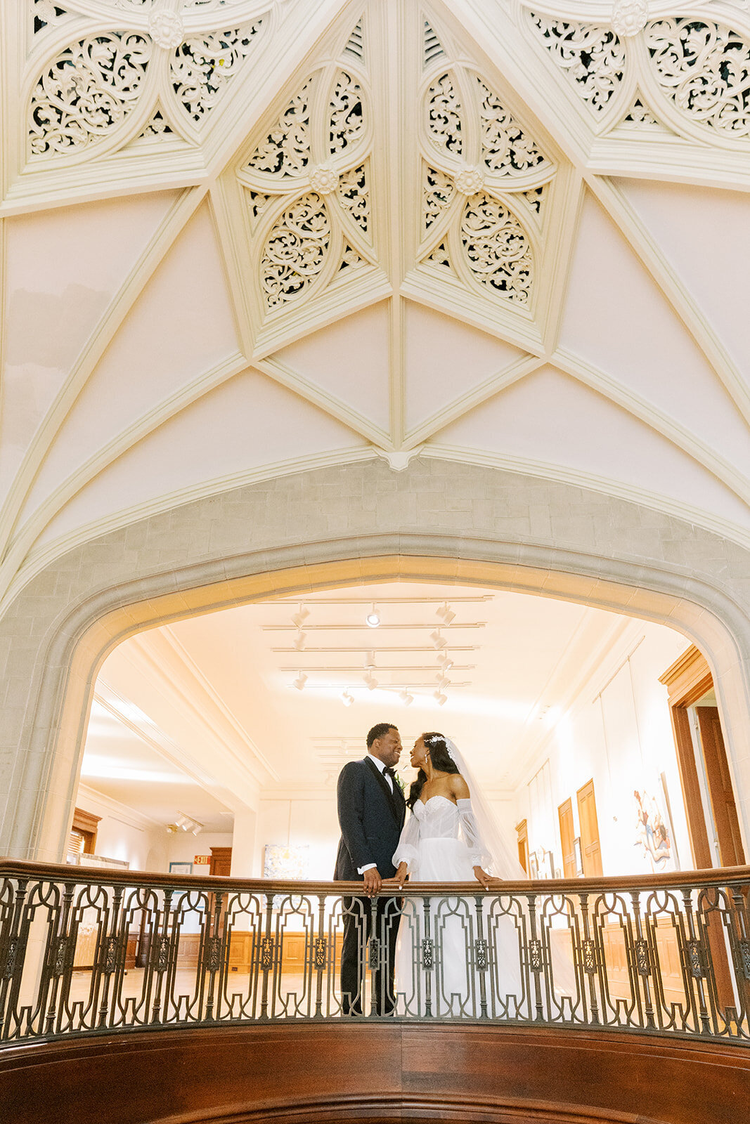 black-couple-at-the-top-of-the-callanwolde-staircase-elizabeth-austin-photography