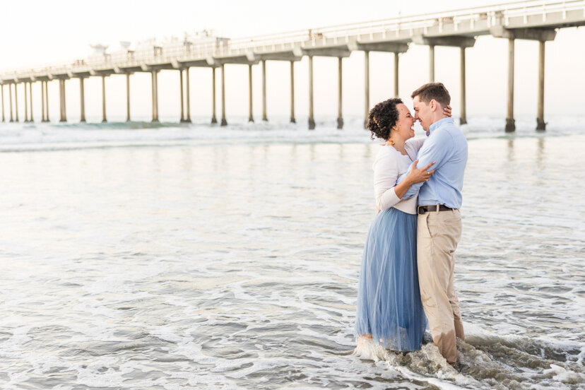 engaged-couple-in-water-near-Scripps-Pier-san-diego