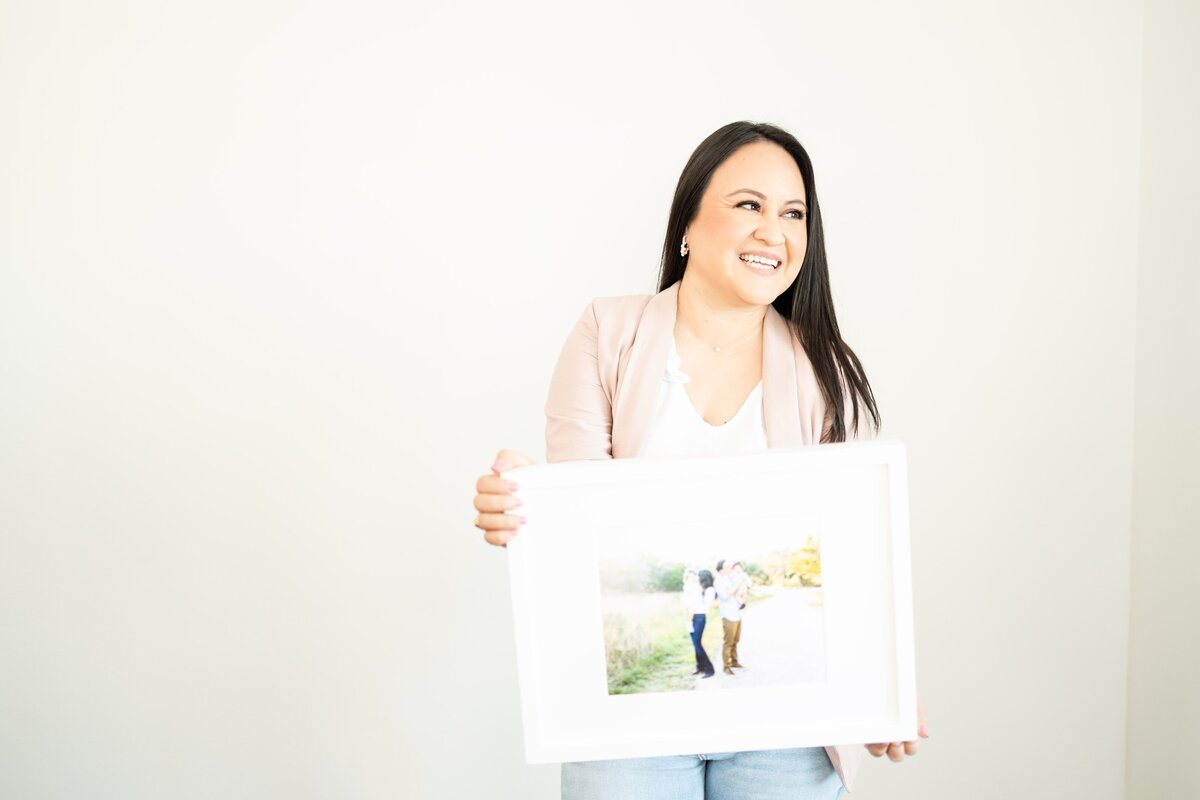 photographer holding photo frame