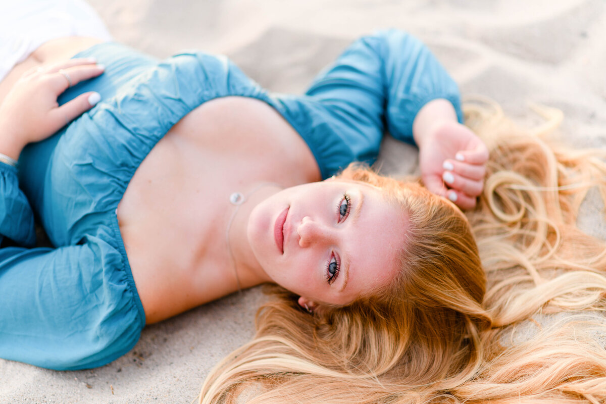 Photo by Massachusetts senior photographer Christina Runnals |  Senior pictures of girl laying on beach