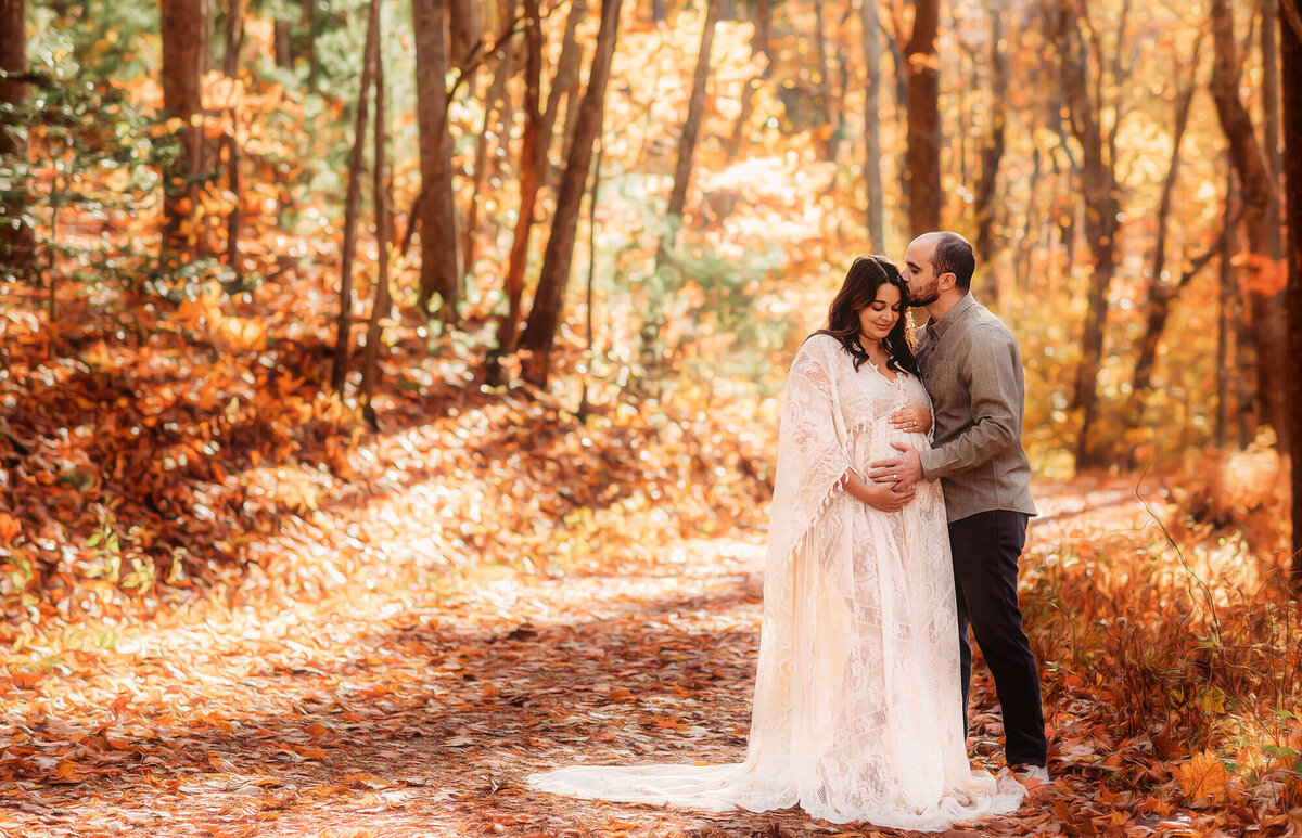 Expectant parents pose for Maternity Portraits in Asheville, NC.