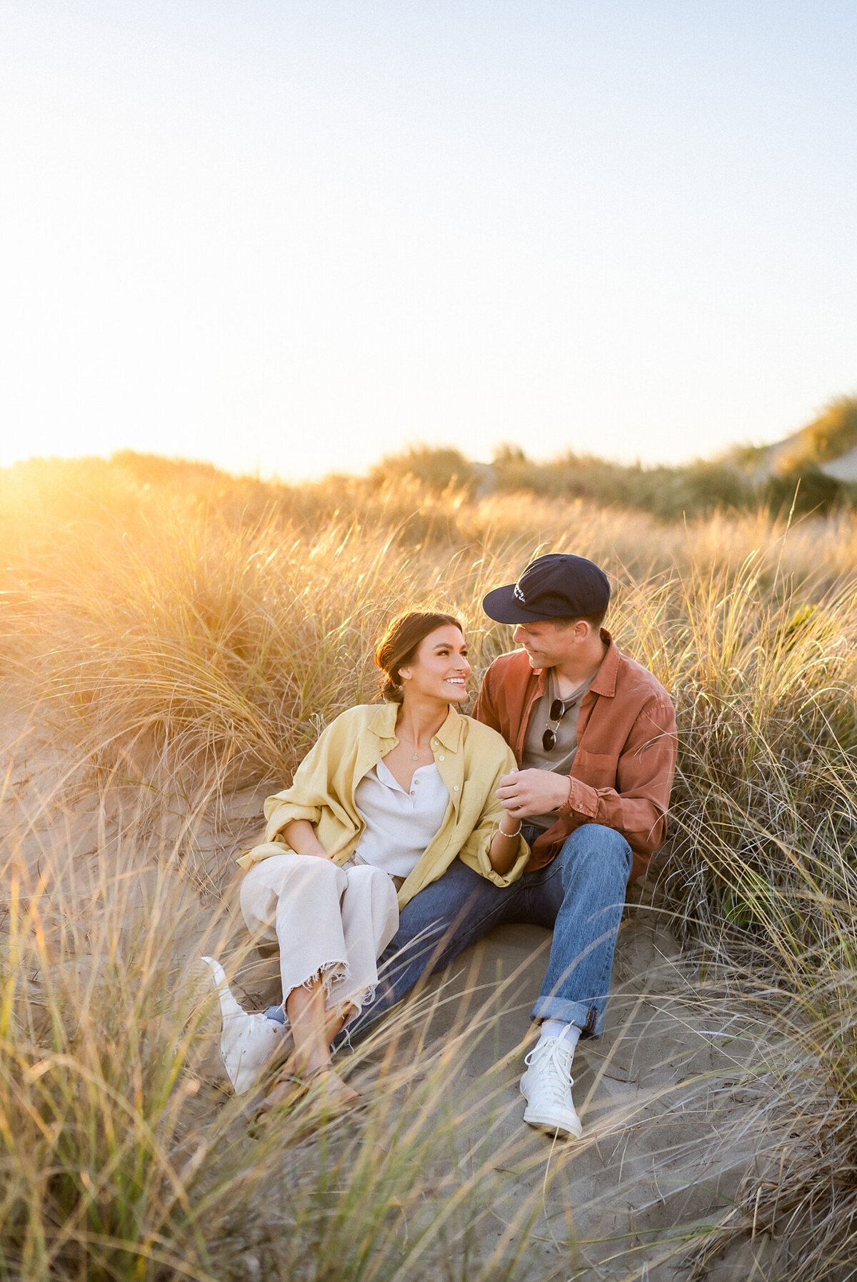 Couple sitting in tall grass