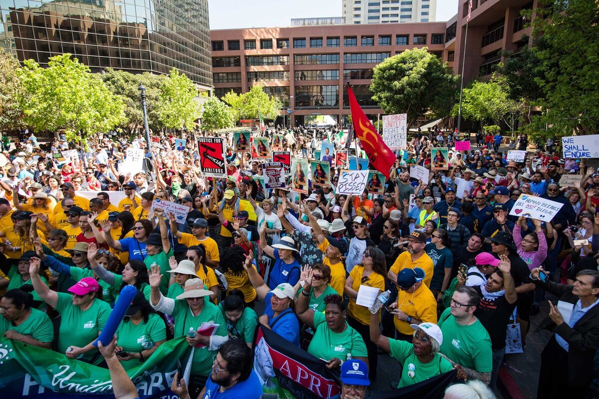 Large Crowd gathers outside the municiple building downtown San Diego