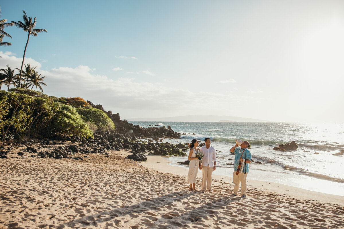 Maui Wedding Photographer captures bride and groom during beach elopement ceremony