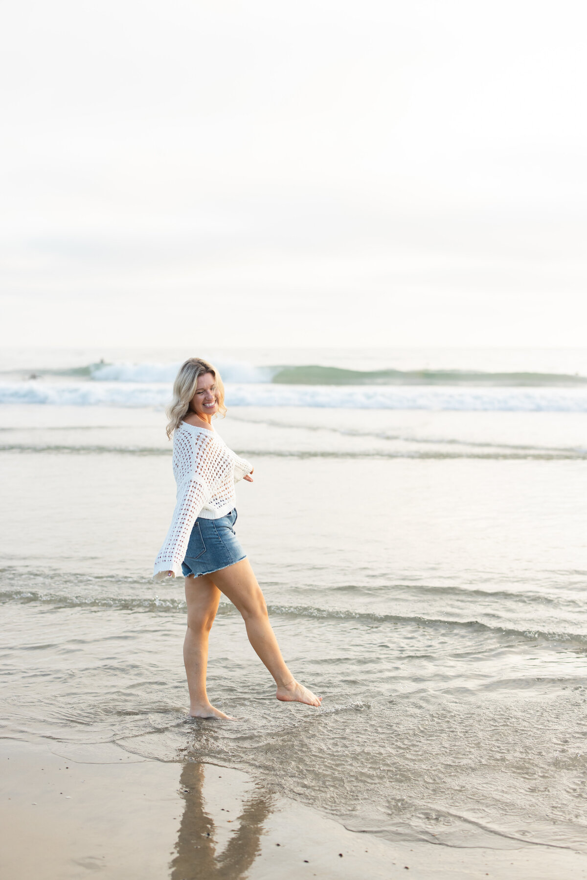 Tara Dunn walking on the beach, a business that supports your life