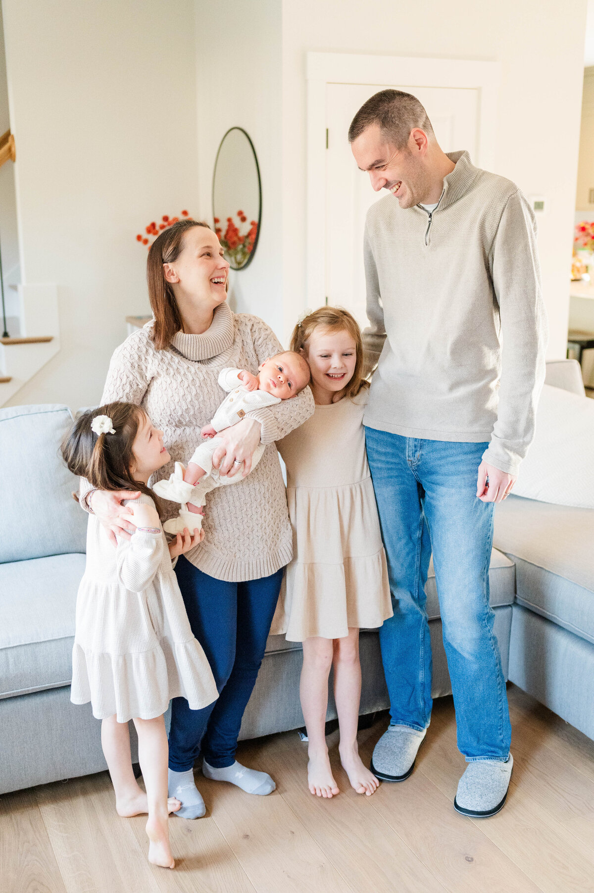 Family photo standing up laughing at each other taken in Sutton, MA 