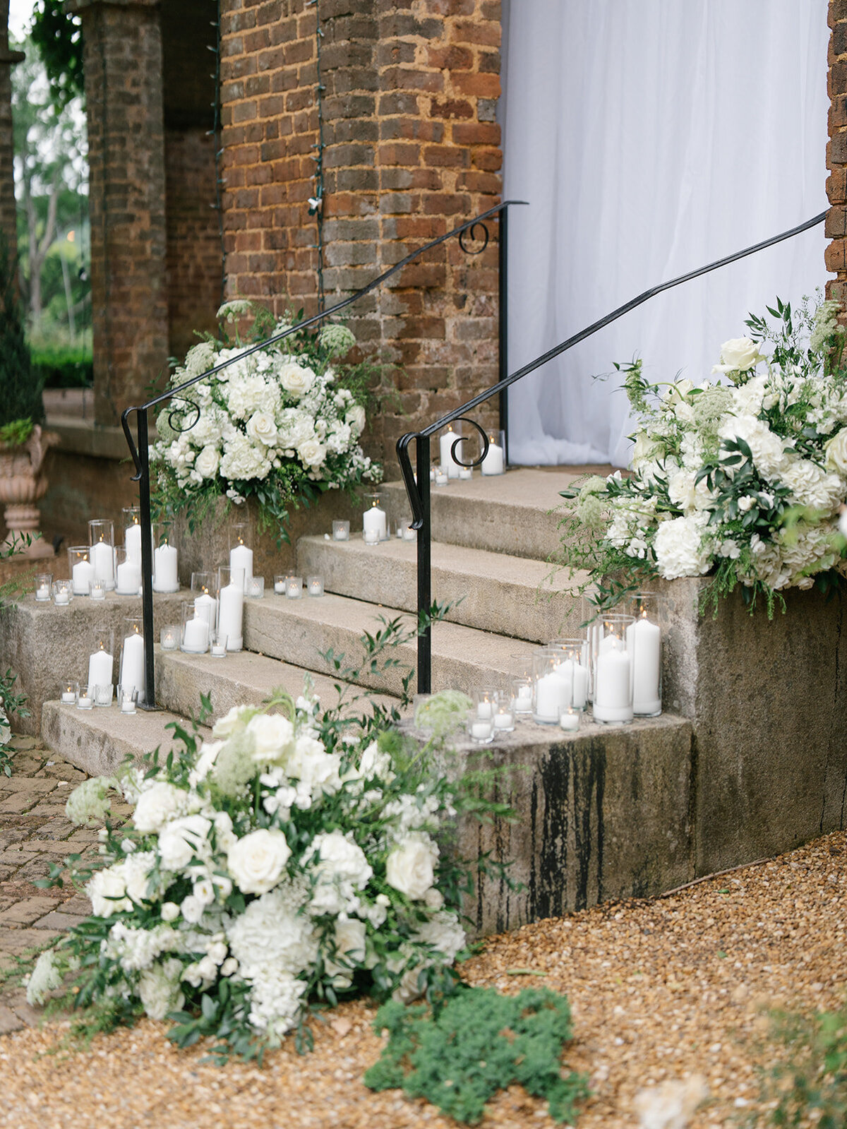 white and green flowers at wedding ceremony