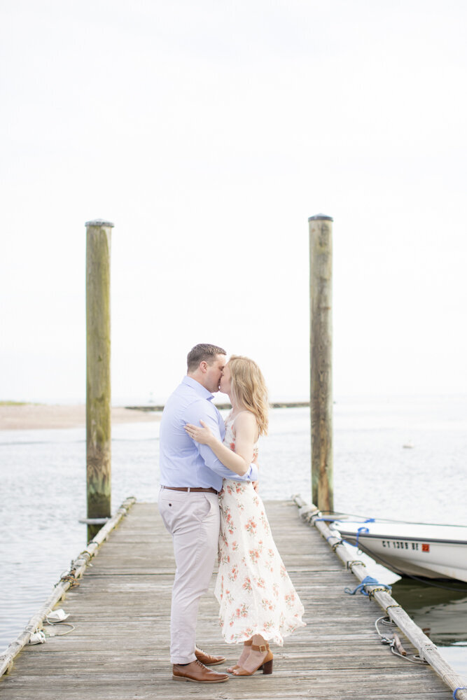 Southport CT dock engagement portrait, couple kissing
