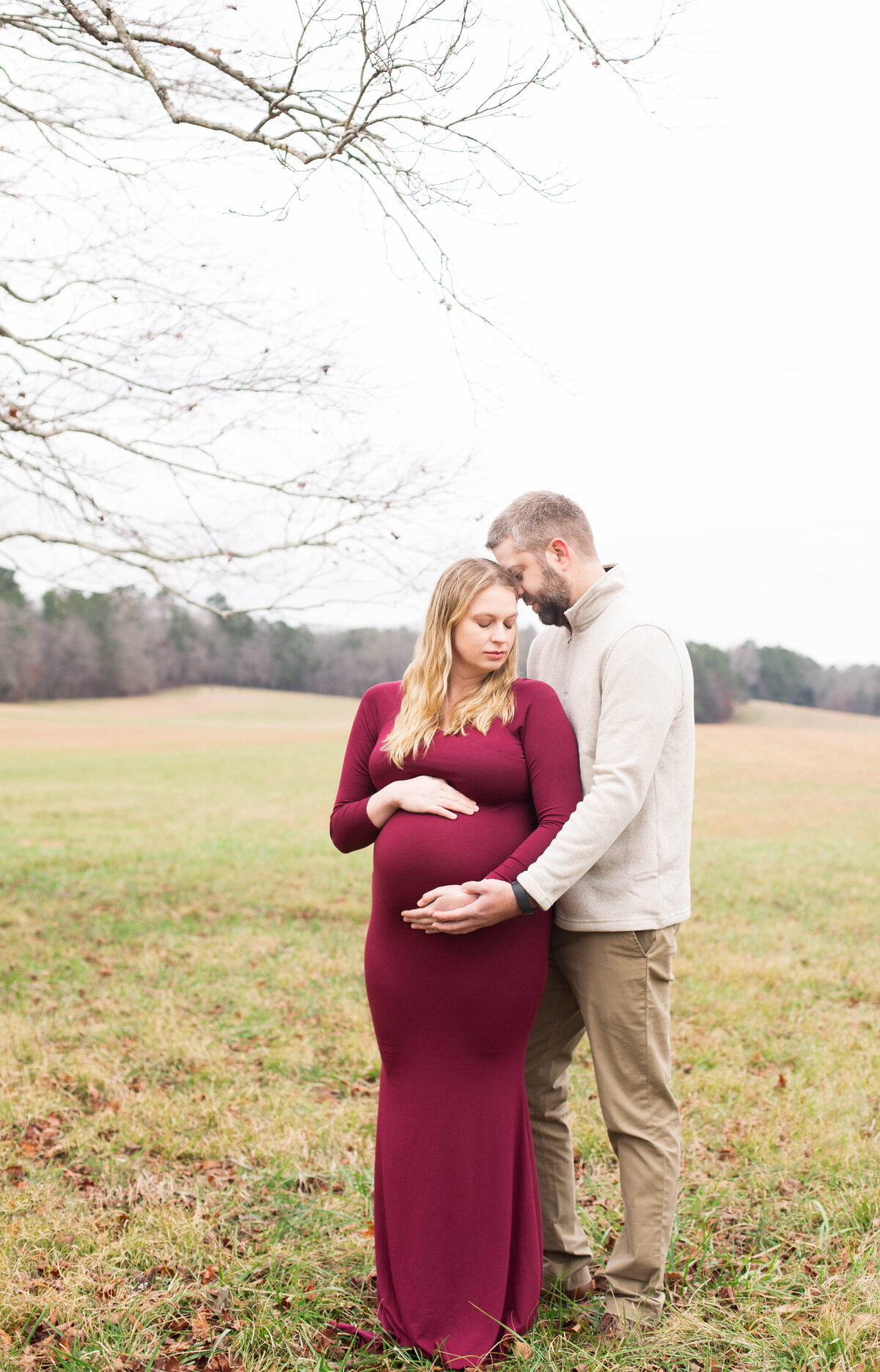 couple posing for maternity session at Chickamauga Battlefield in winter