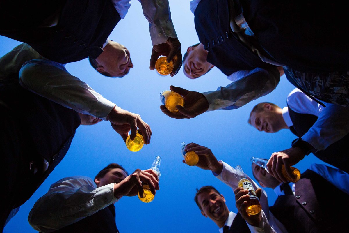 Groomsmen drinking beer by Parksville photographer