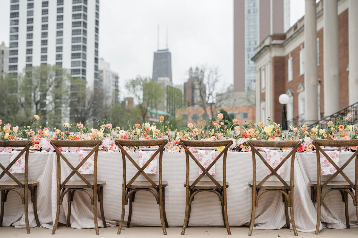 Wedding reception table with flowers and chairs, captured by wedding photographer in Cincinnati, Ohio
