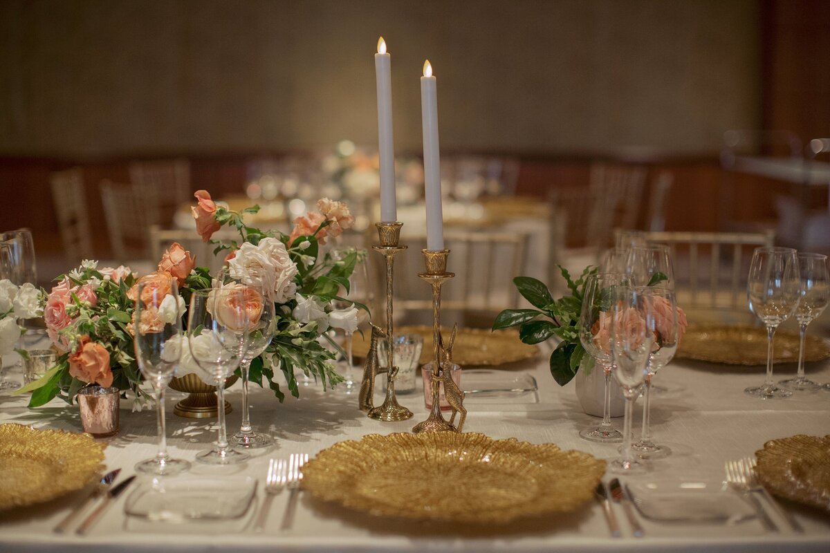 Gold and pink reception wedding tabletop.