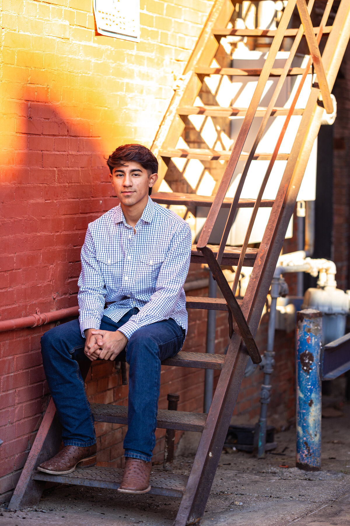 High school senior posing outdoors with warm evening light — authentic Dallas–Fort Worth senior photography by Poppy + Blue Photography