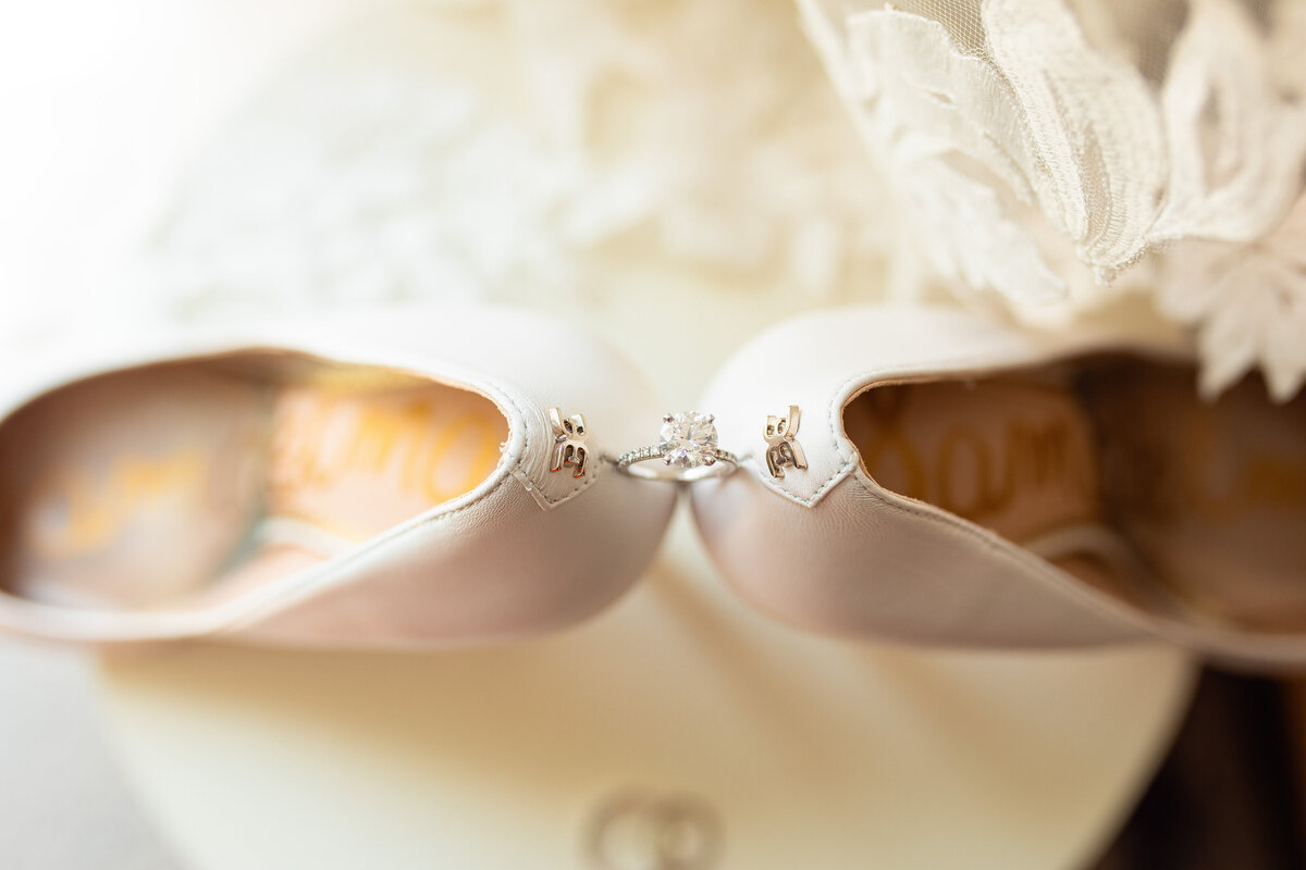 Engagement ring on bridal heels.
