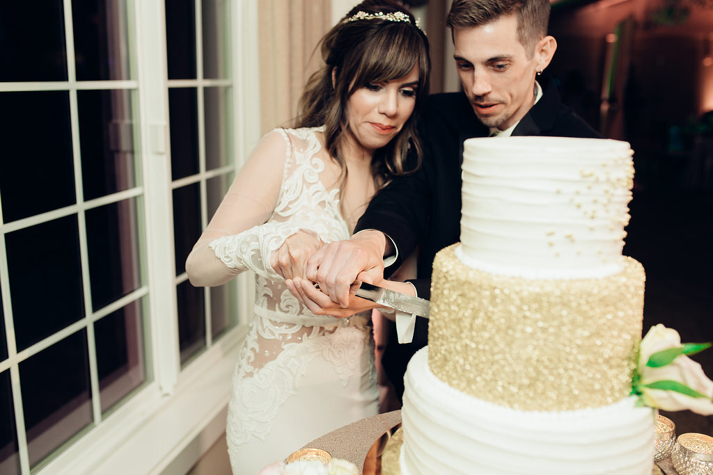 Wedding Photograph Of Bride And Groom Taking a Slice Of The Wedding Cake Los Angeles