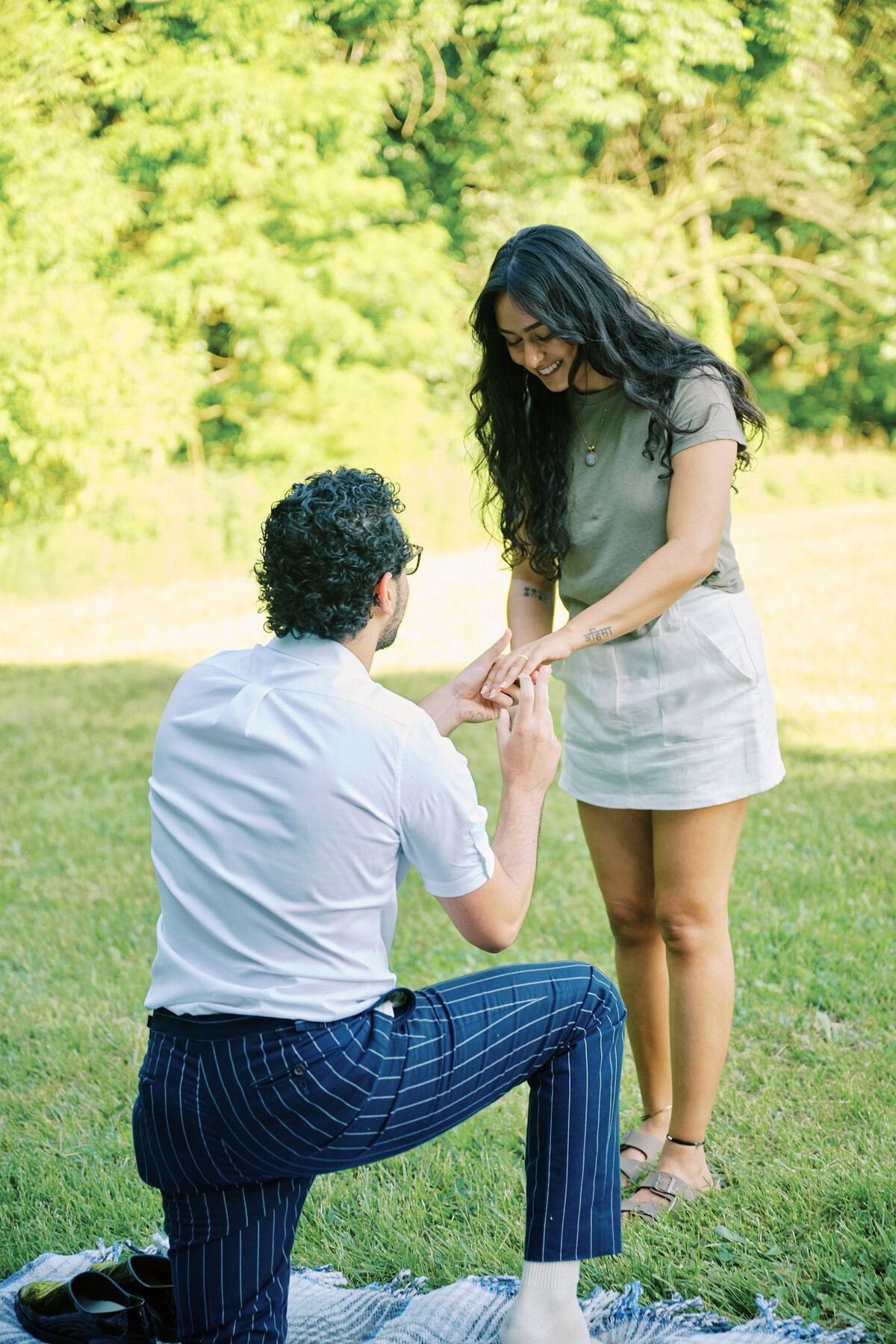 A Proposal is taking place in New York CIty, Queens Park; photo taken by Corey Lamar Photography