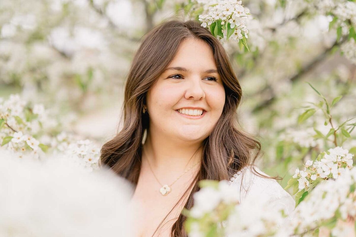 University student poses for spring graduation photos