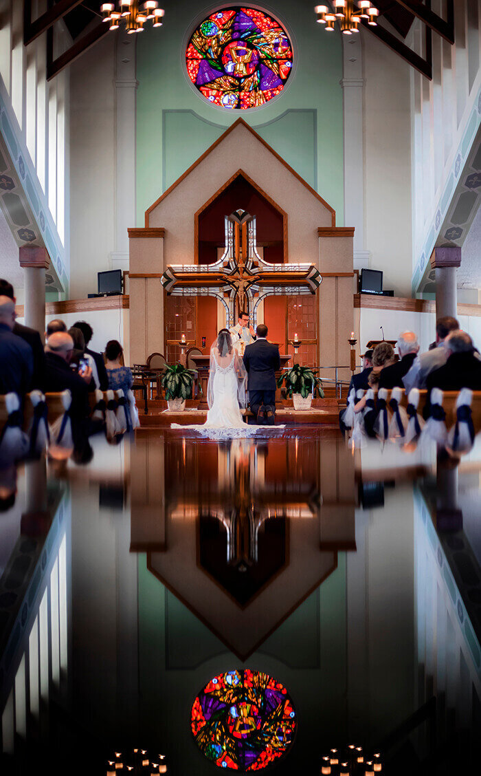 bride-groom-kneel-altar-water-reflection-church