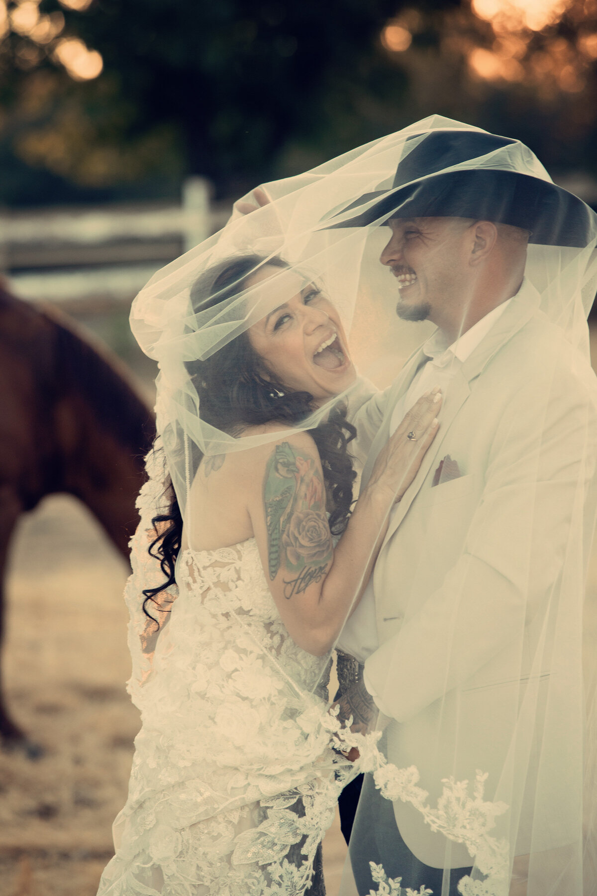 bride and groom laughing
