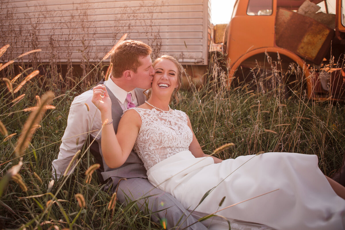 Couple in Filed with Truck Rustic Wedding Photos in Nebraska