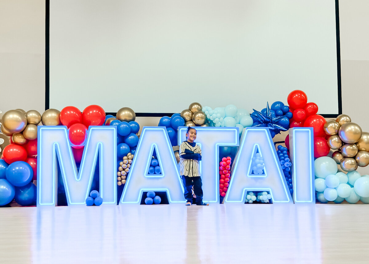 marquee letters and blue red gold balloons