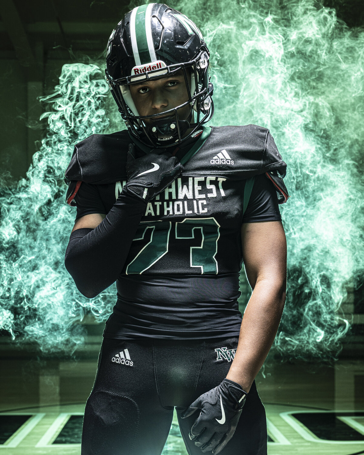 CT Photographer | Media Day Photos | Football Player Photos - Football player posing strong with green smoke in background. 