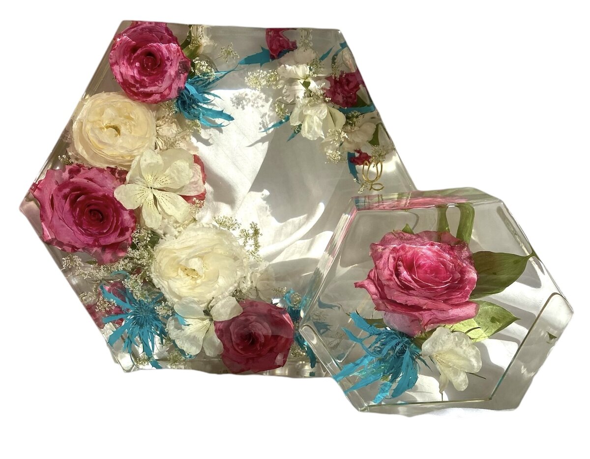 hexagon resin block with pink and torques wedding flowers preserved alongside grooms boutonniere as a timeless family keepsake