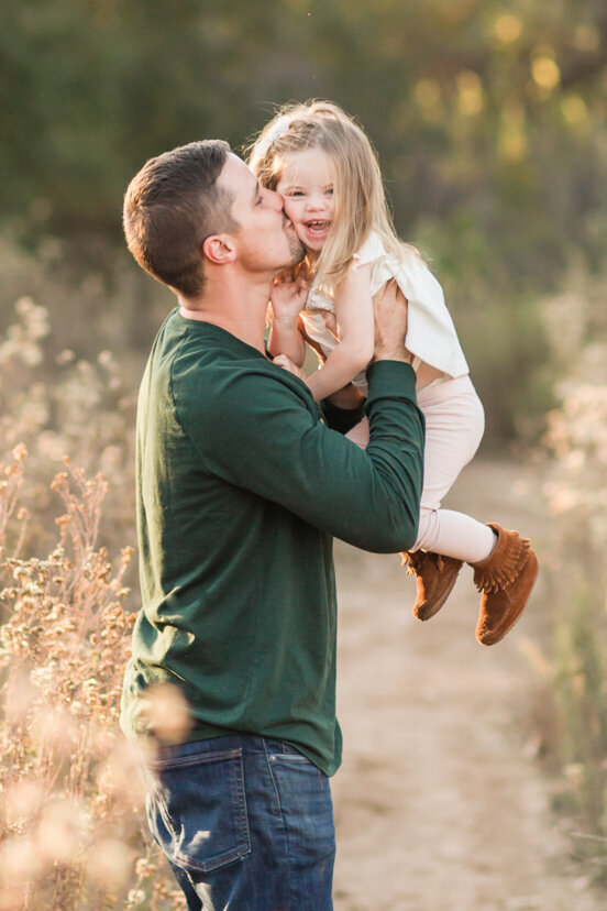 father-holding-up-daughter--sweetwater-river-bridge-san-diego