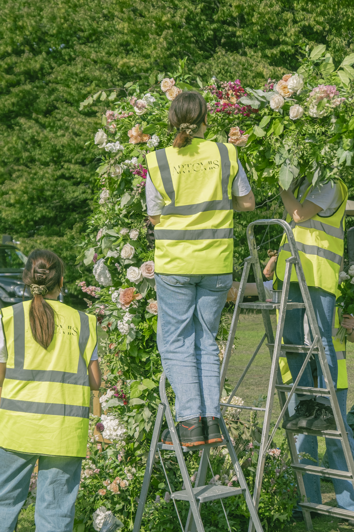 Studio Artemis team working on an arch for a brand event
