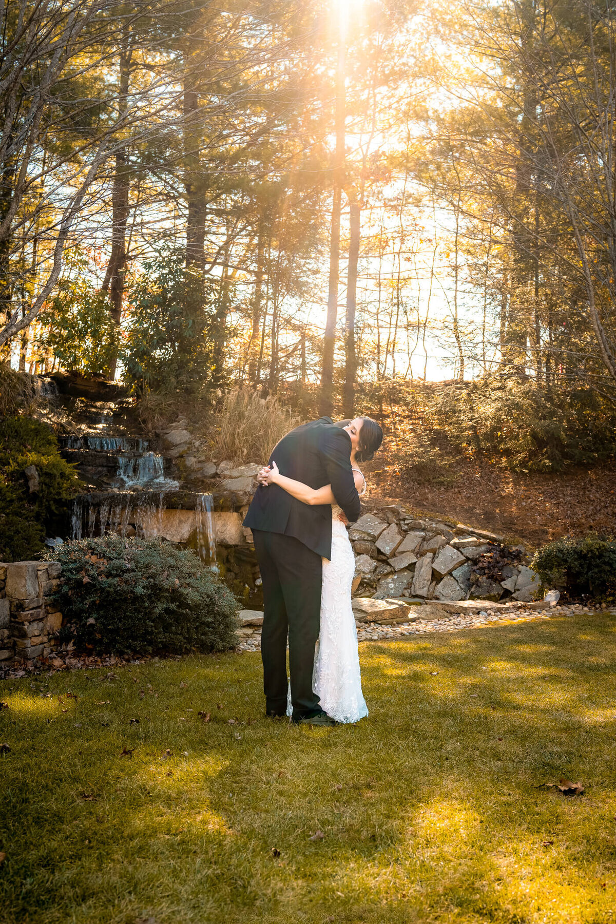 Bride and groom hug each other after a private first look during the sunrise. Captured by Pittsburgh Wedding Photographer Michael Fricke Photography..