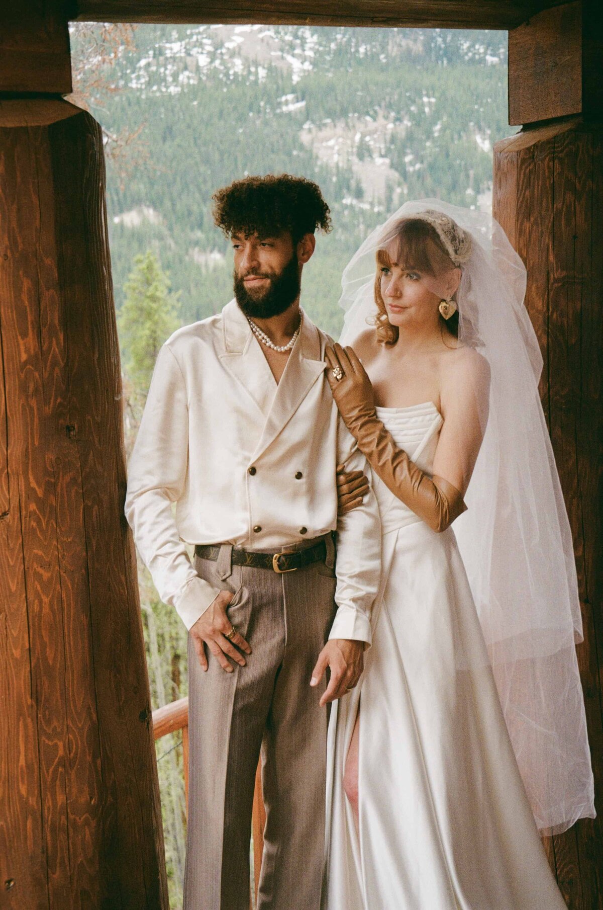 A bride and groom pose for a photo during their elopement in Leadville, Colorado.