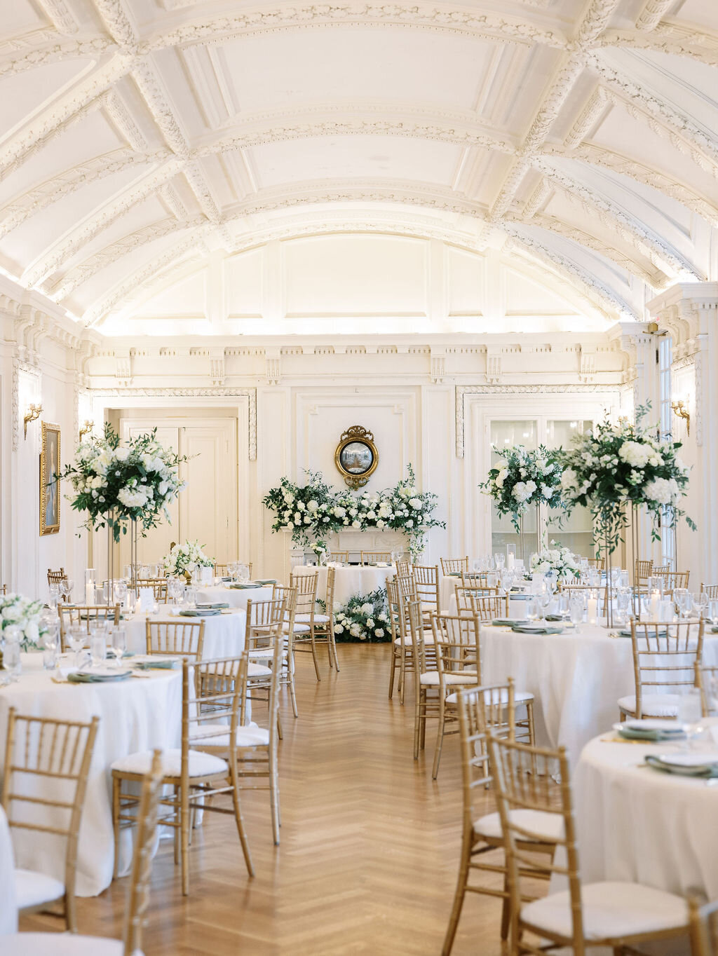 Wedding ceremony set-up with classic whites & greens.