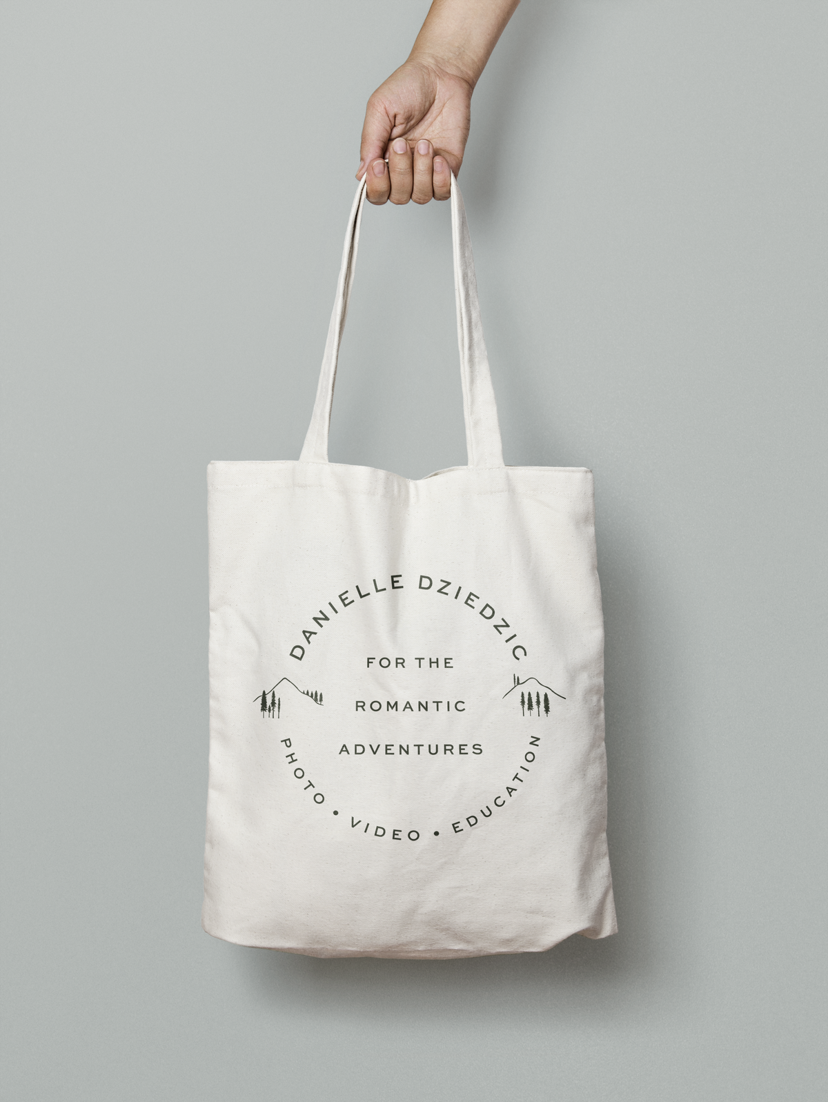 mockup of a fun stamp logo on a tote bag