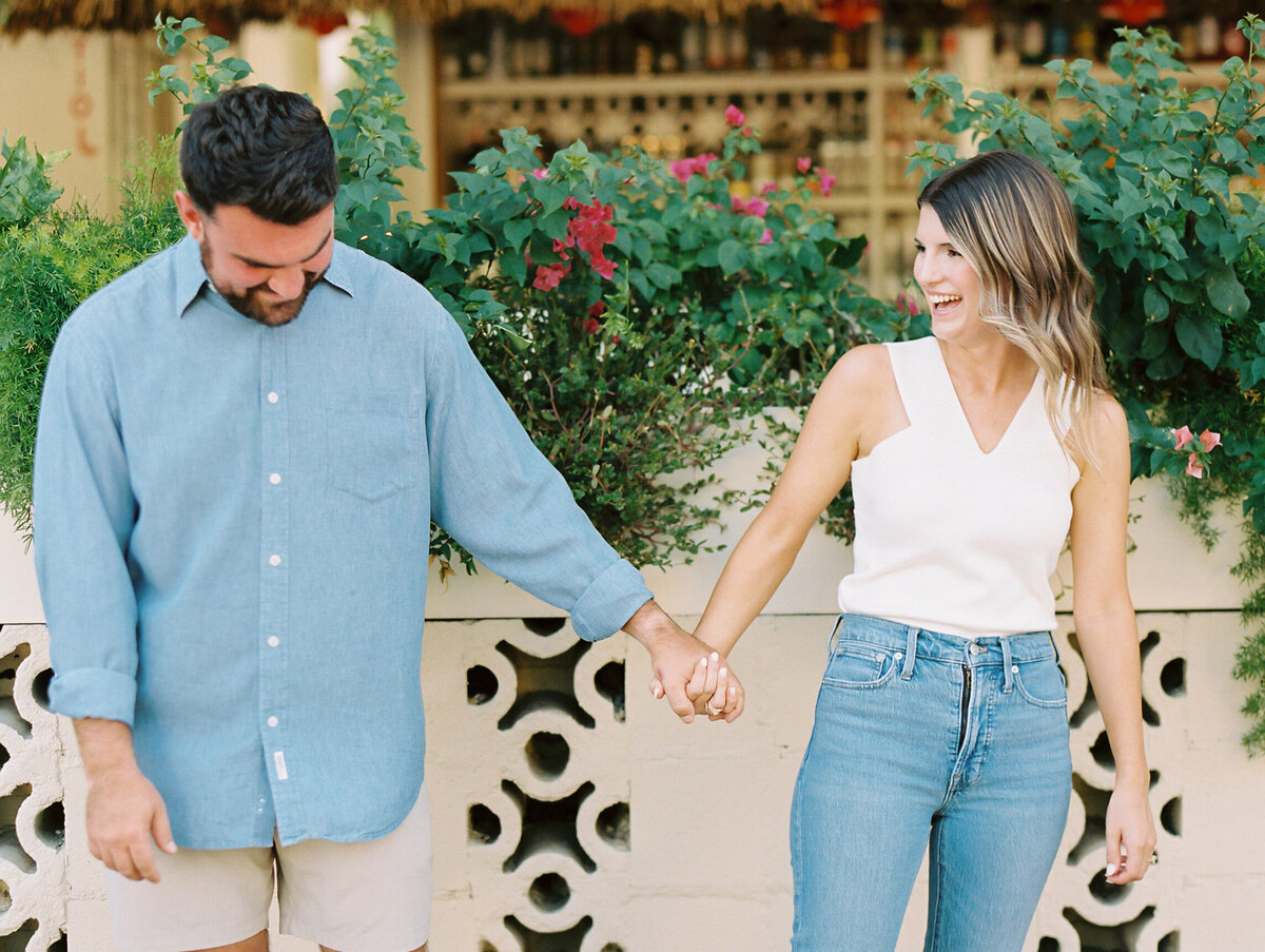 Couple smiling and holding hands