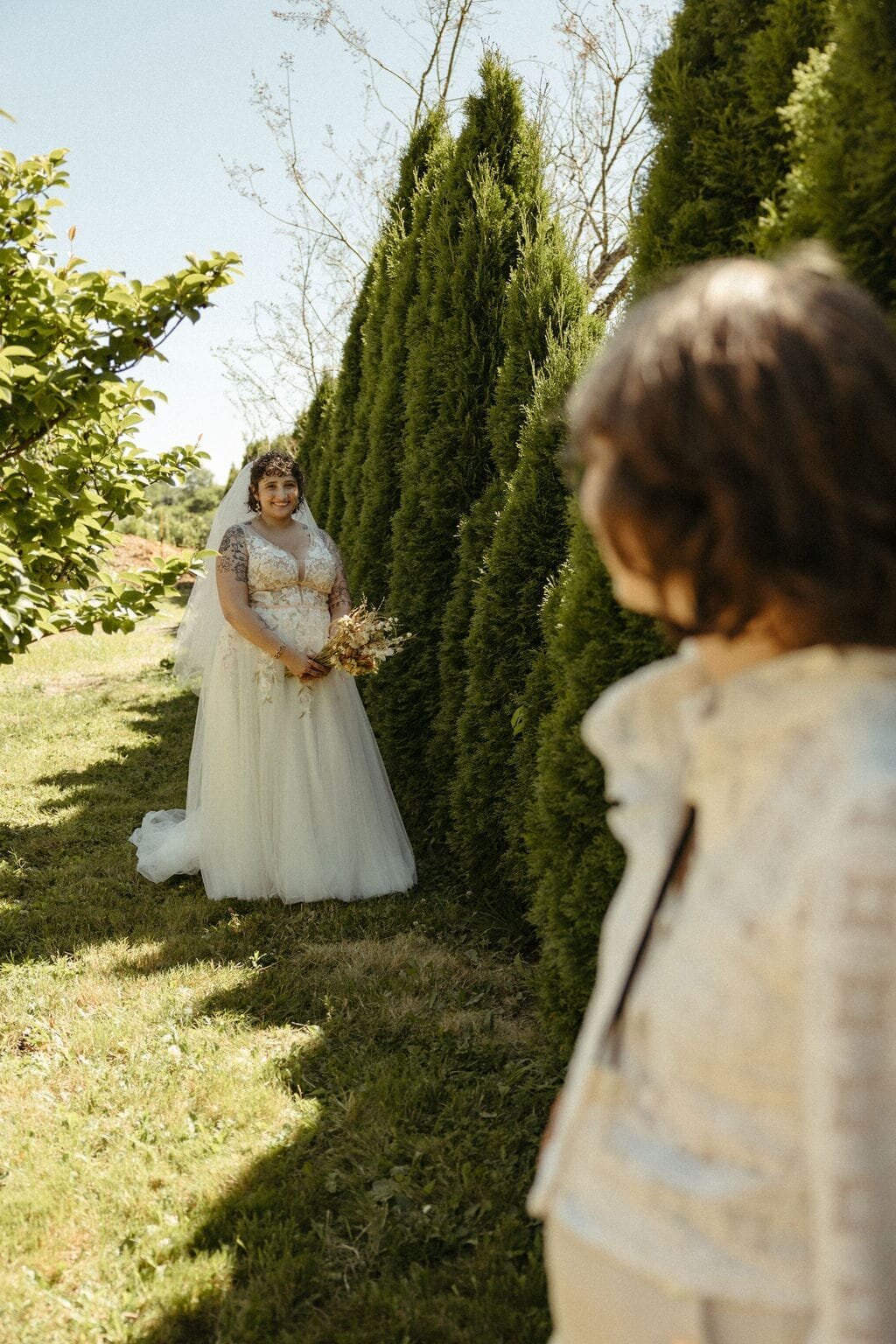Two brides share a romantic first look during an intimate wedding photographed by Wilder Photography