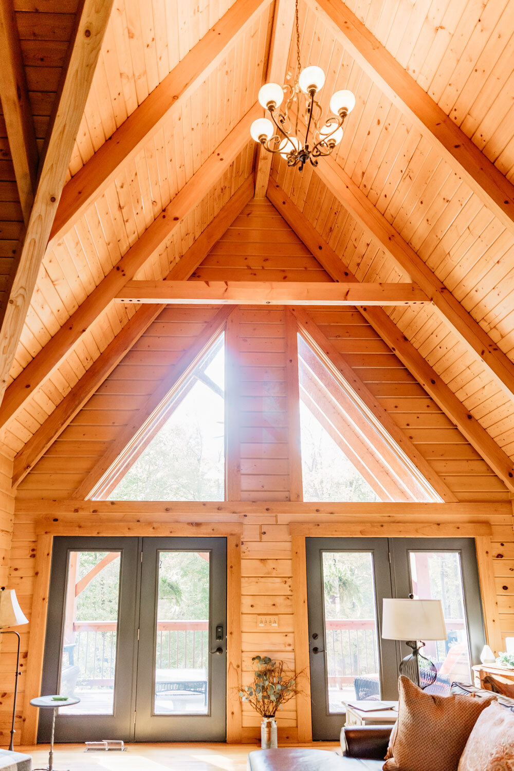 High vaulted ceiling with natural wood interior and large windows