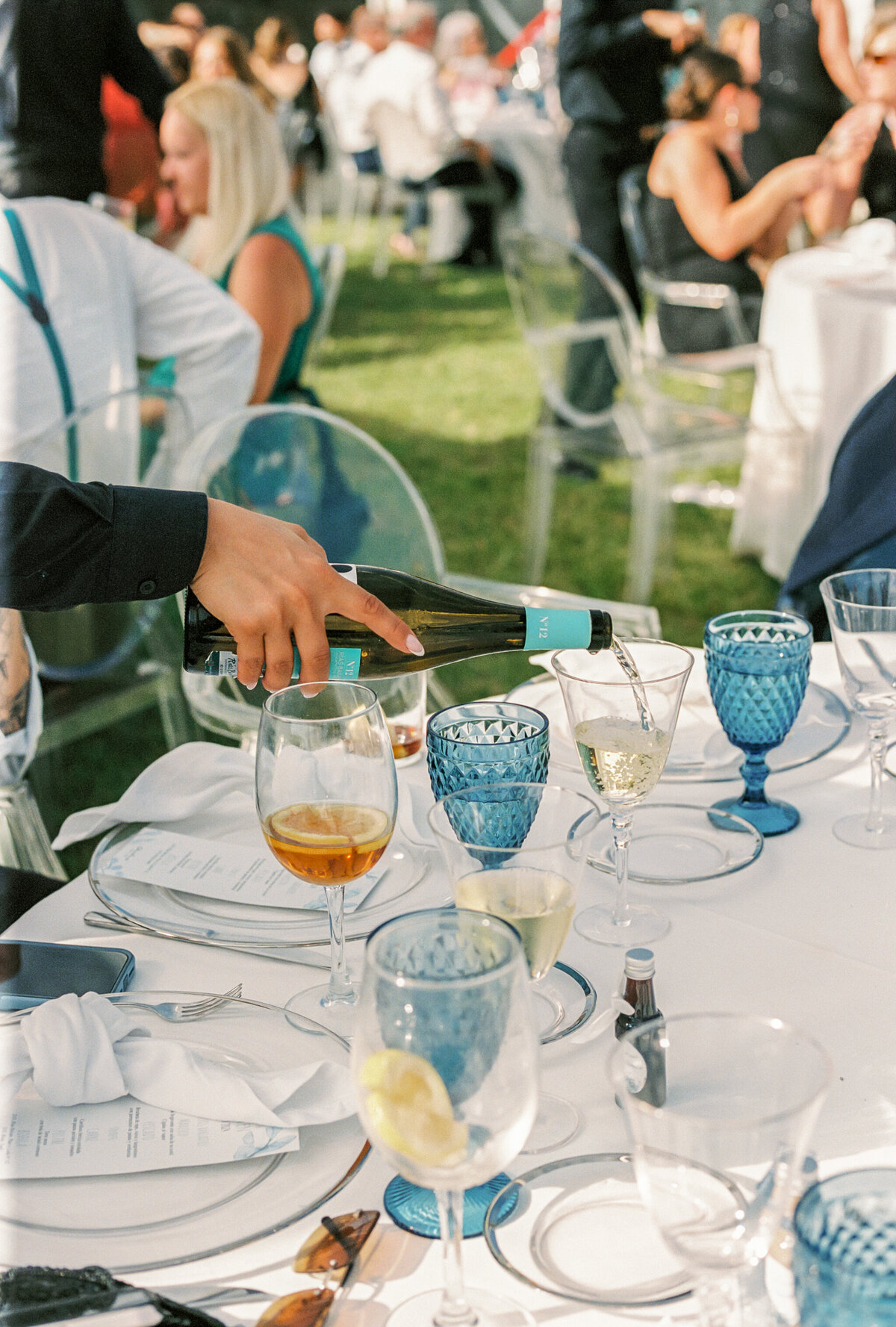 Destination Wedding in Spain | waiter pours wine at table