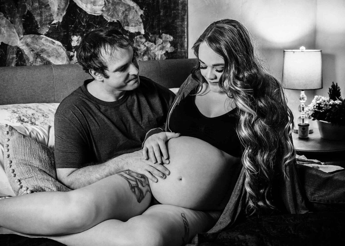 Maternity couples photo man and wife on bed together, Missoula, MT