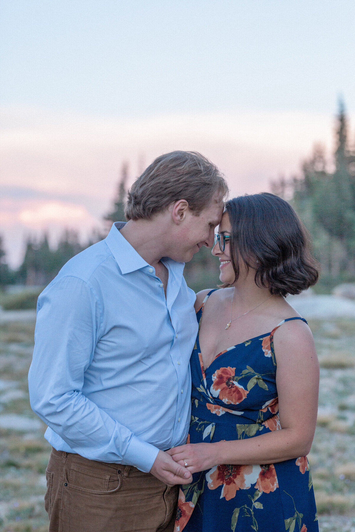 A couple pose for the engagement photos, with noses touching during their Brainard Lake engagement session. 