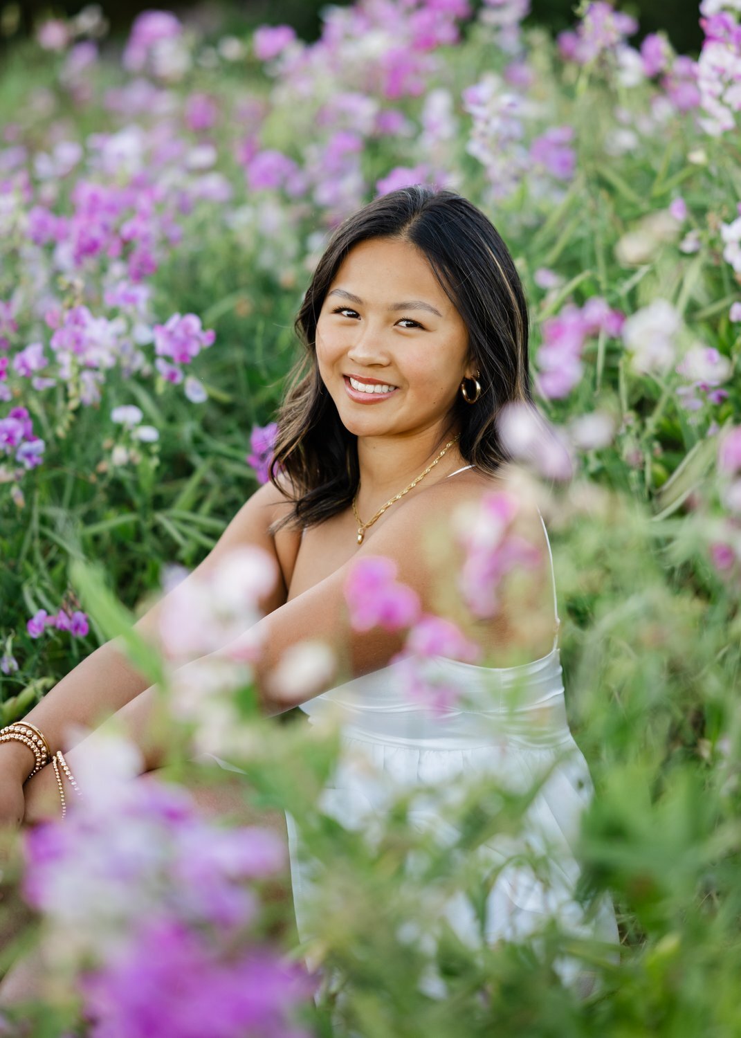 discovery park wildflowers senior seated in white dress