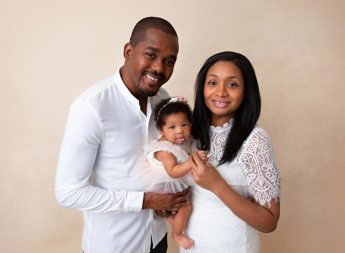 First time parents holding their baby for baby photography  pictures