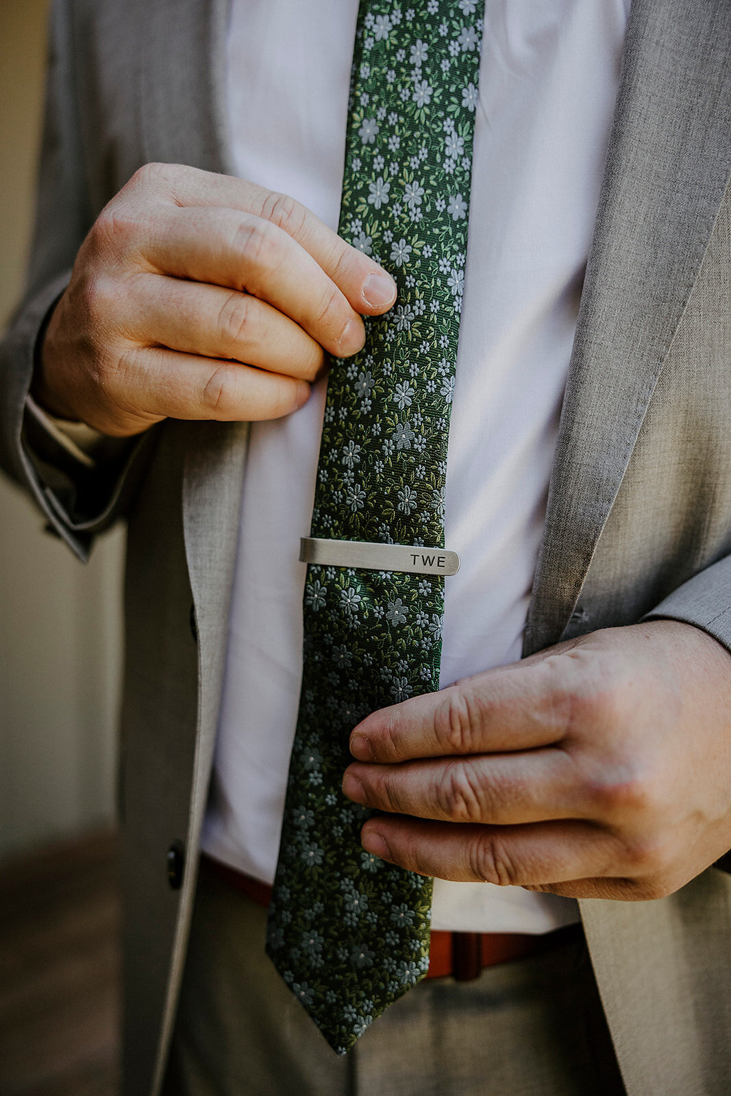 groom portrait green floral tie