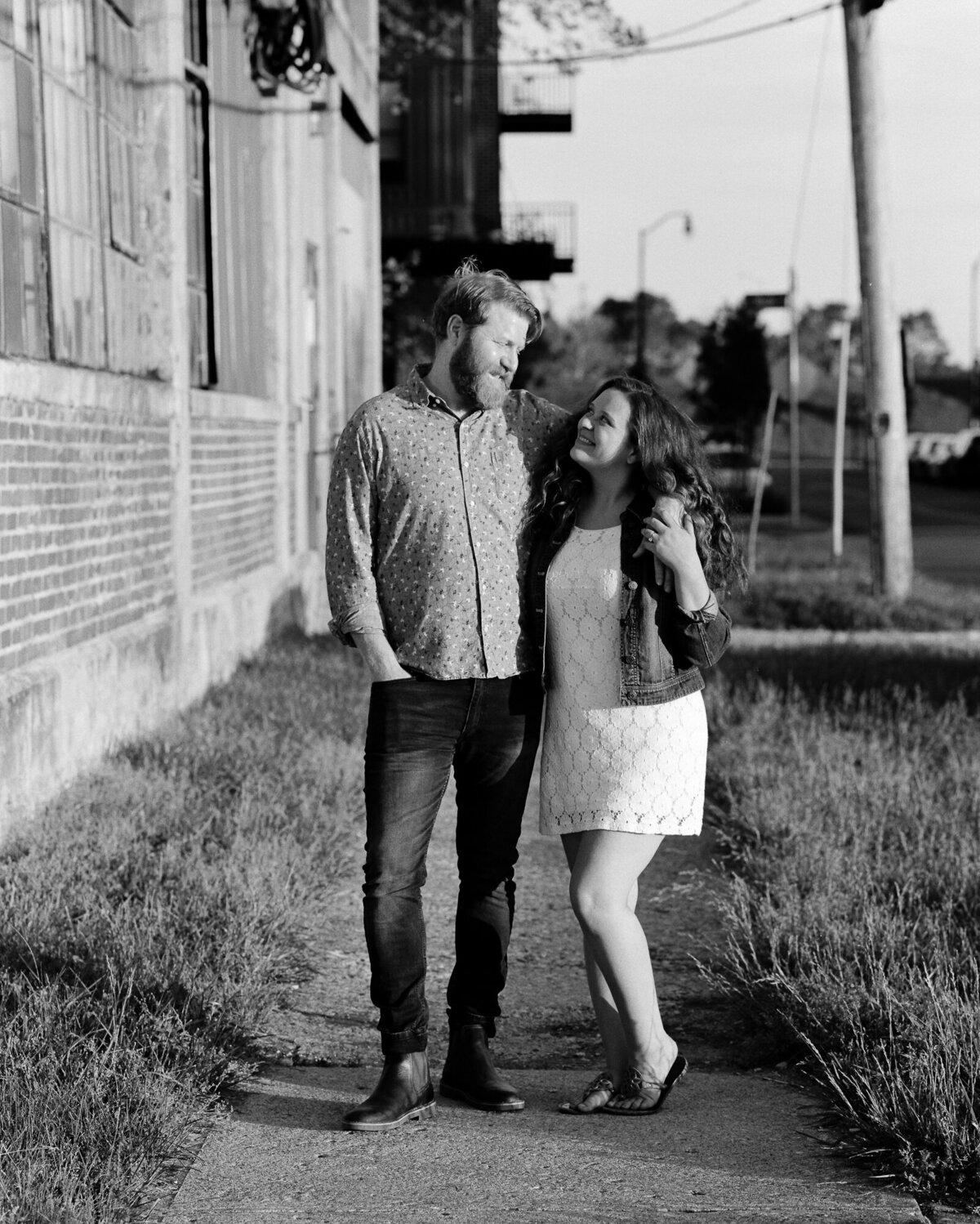 Couple poses during engagement session for photos on the Pentax 67 ii