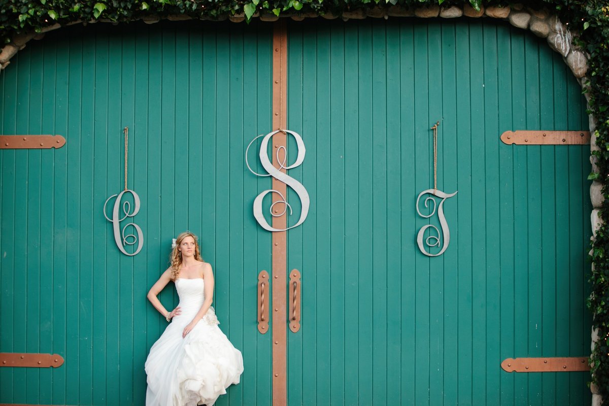 Bride in front of barn doors River Highlands Ranch, CA