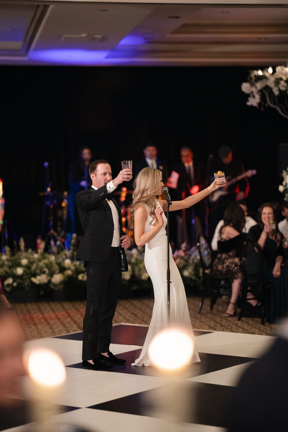 Bride and groom raising glasses during wedding reception in Paradise Valley