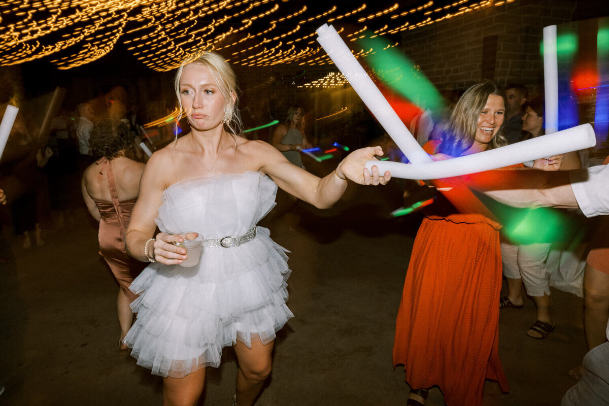 bride-in-cute-reception-dress-holding-led-wand