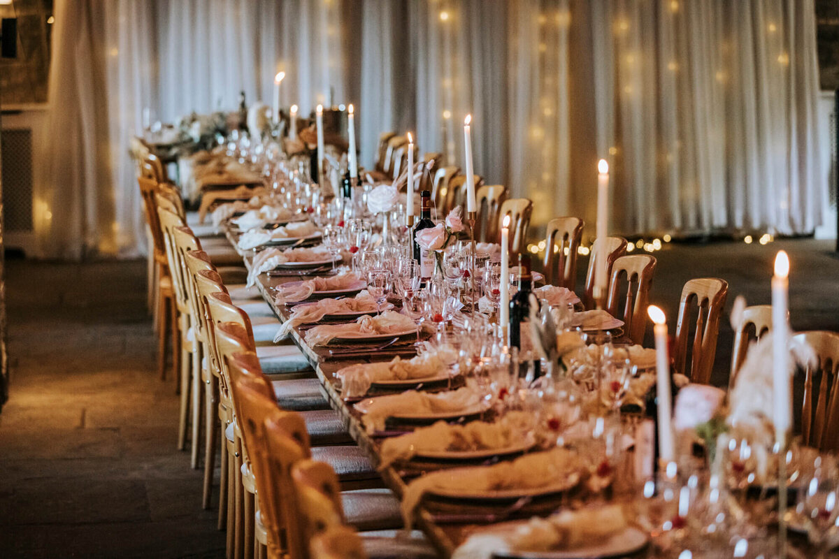 A long table is set for a formal dinner