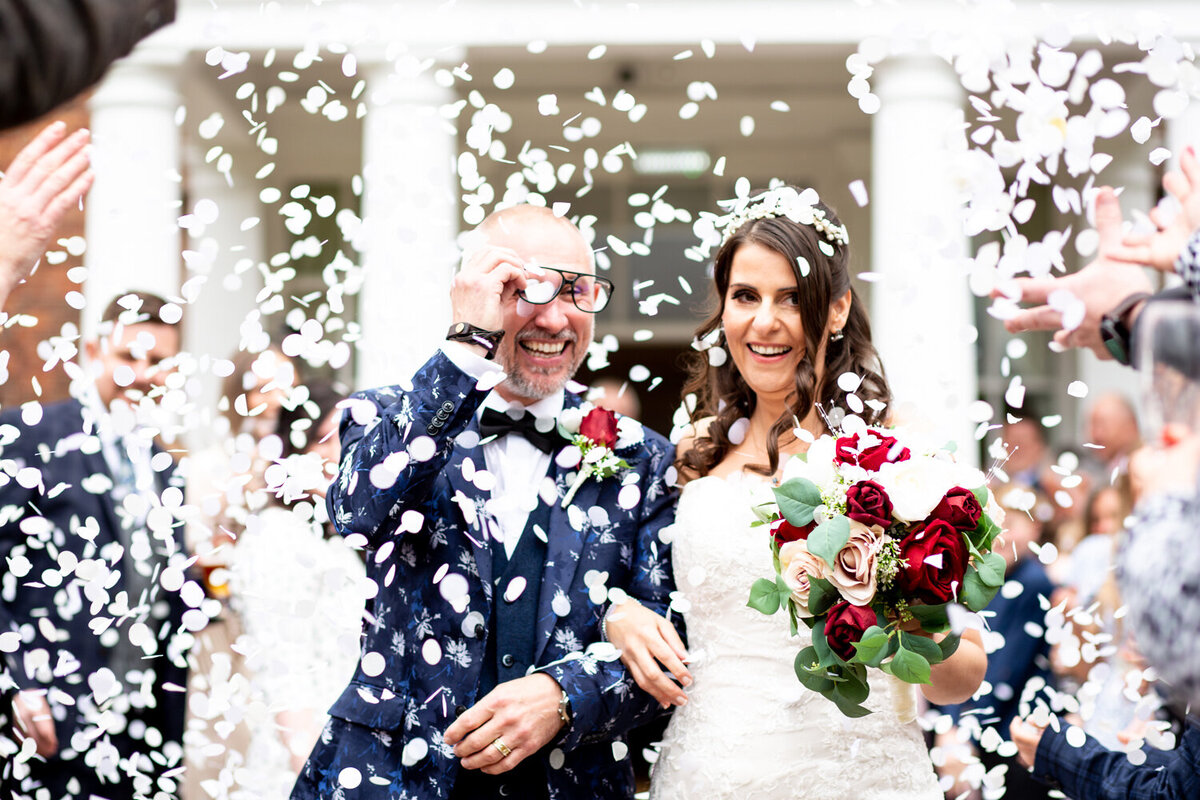 couple walking through confetti