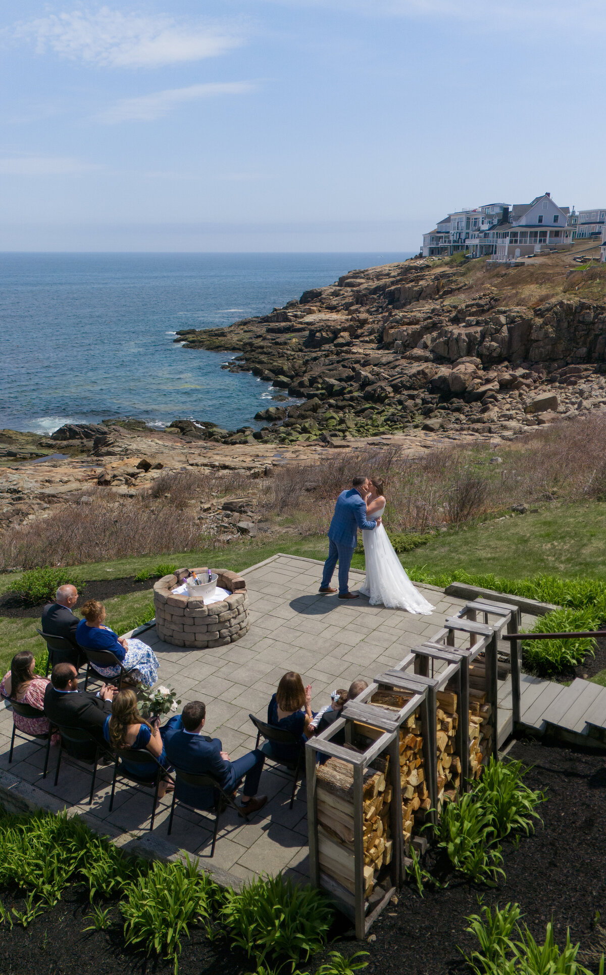 Maine elopement photographer capture a stunning wedding ceremony on the cliffs of Nubble Lighthouse in York, Maine (arianna lyn photography, cape cod wedding photographer)